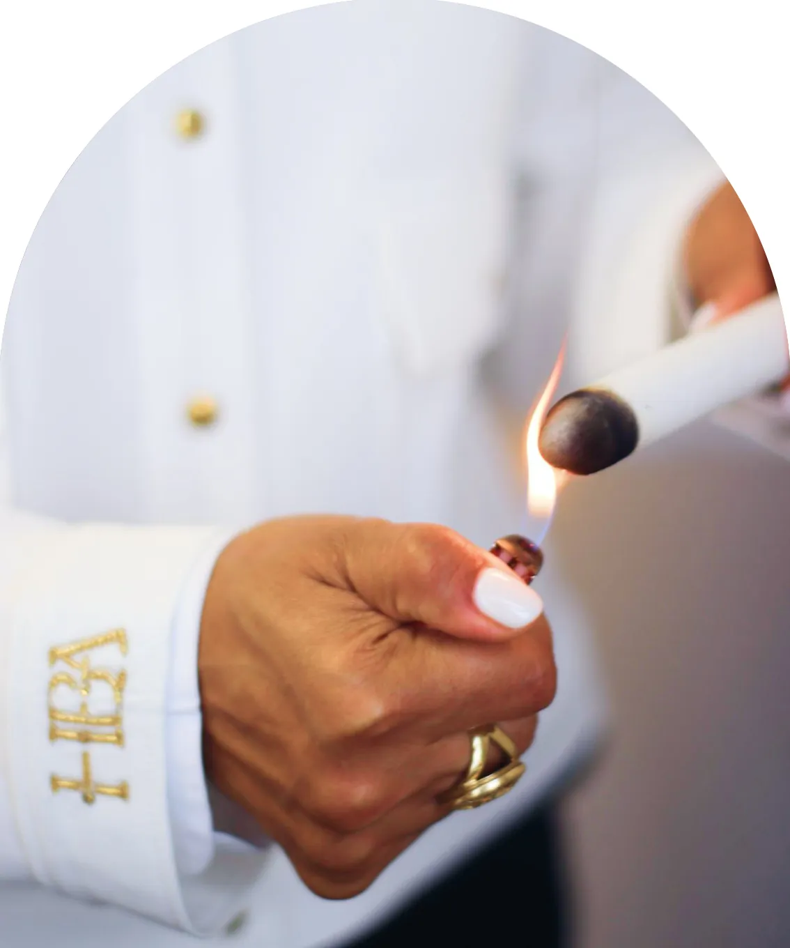 Pinky Lalwani lighting a moxa stick for moxibustion therapy
